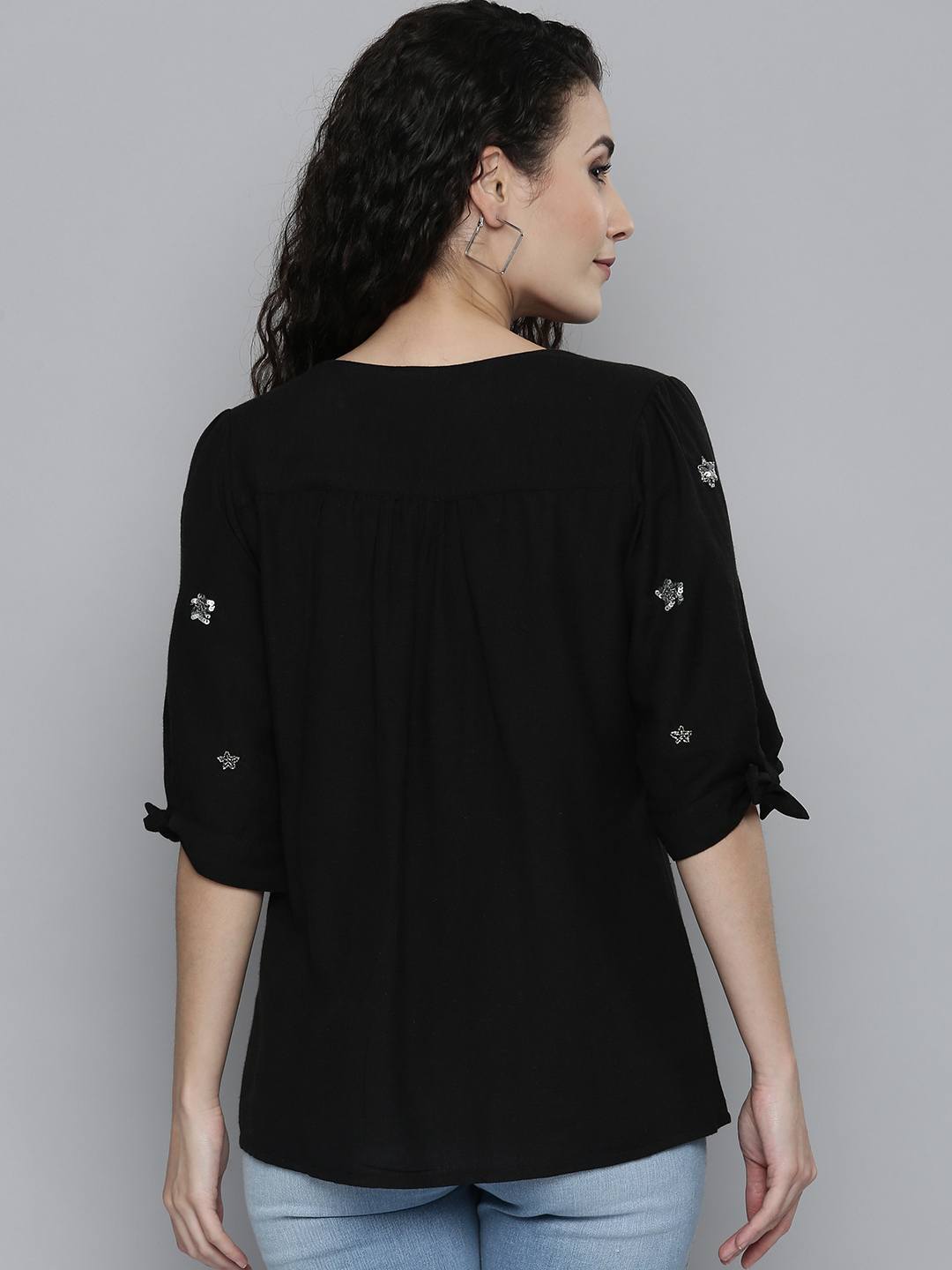 Embellished black top